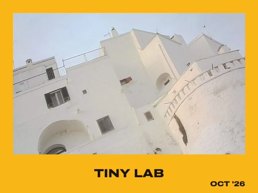 A white house in a yellow instant-print border
